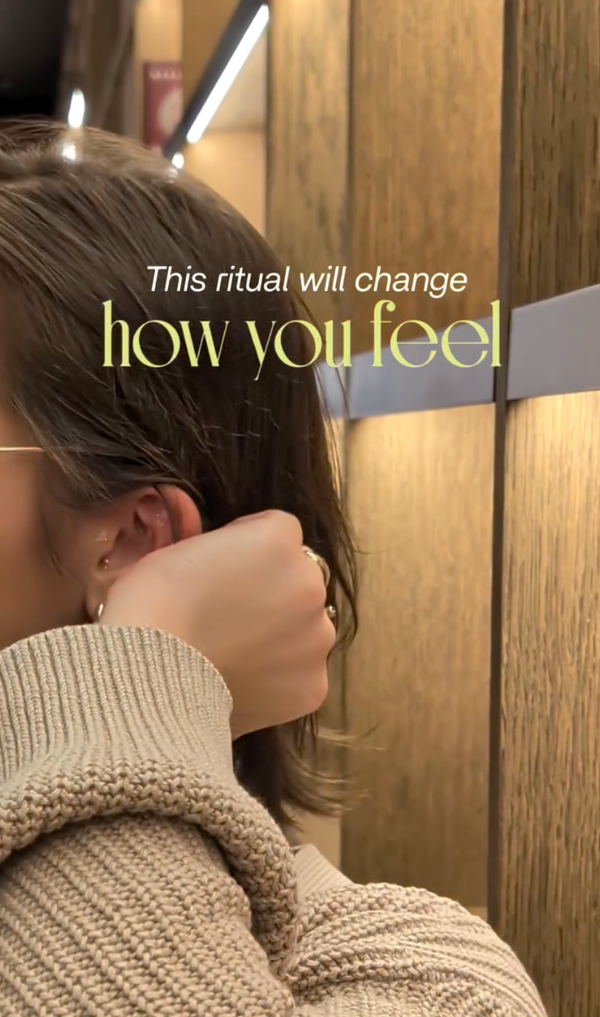Person sitting in a chair with text overlay 'This ritual will change how you feel' in a salon setting.