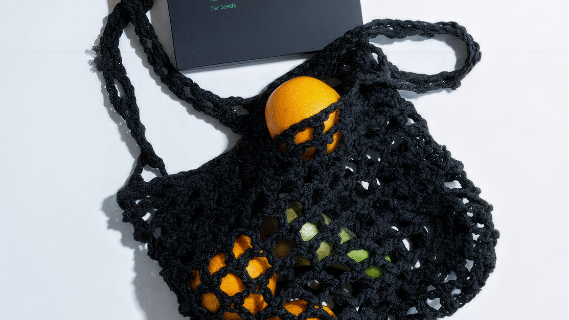 Black mesh bag with colorful vegetables on a white background